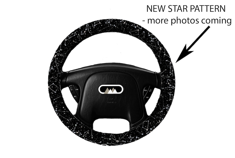 May include: Black steering wheel cover with a white constellation pattern.  The text "NEW STAR PATTERN - more photos coming" is visible in the image.