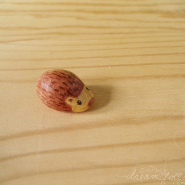 Tiny red brown hedgehog mini figure