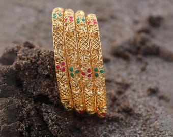 Gold Plated Traditional Bangle Set for Women – Intricate Floral Design with Ruby & Green Stones – South Indian Bridal Jewelry