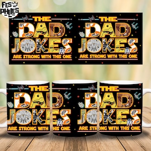 May include: White ceramic coffee mugs with a black design that reads "THE DAD JOKES ARE STRONG WITH THIS ONE" in orange and brown lettering. The design includes Star Wars themed graphics.