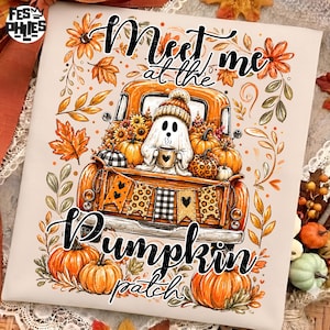 May include: A white t-shirt featuring a graphic of an orange pickup truck filled with pumpkins and sunflowers. A ghost wearing a beanie holds a mug in the truck bed, which is decorated with a banner. The text reads Meet me at the Pumpkin patch.