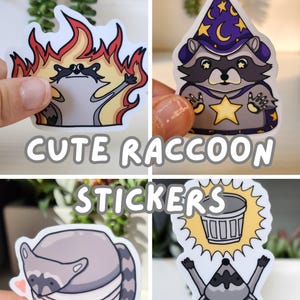 May include: A collection of four cute raccoon stickers. One raccoon is on fire, another is dressed as a wizard, a third is in a trash can, and the last one is celebrating a trash can. The text "CUTE RACCOON STICKERS" is displayed.