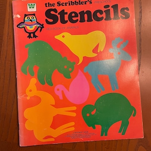 May include: A red book with the title "The Scribbler's Stencils: Red Book of Animals" and a price of 2079-89¢. The cover features colorful animal stencils, including a bear, deer, bird, and buffalo.