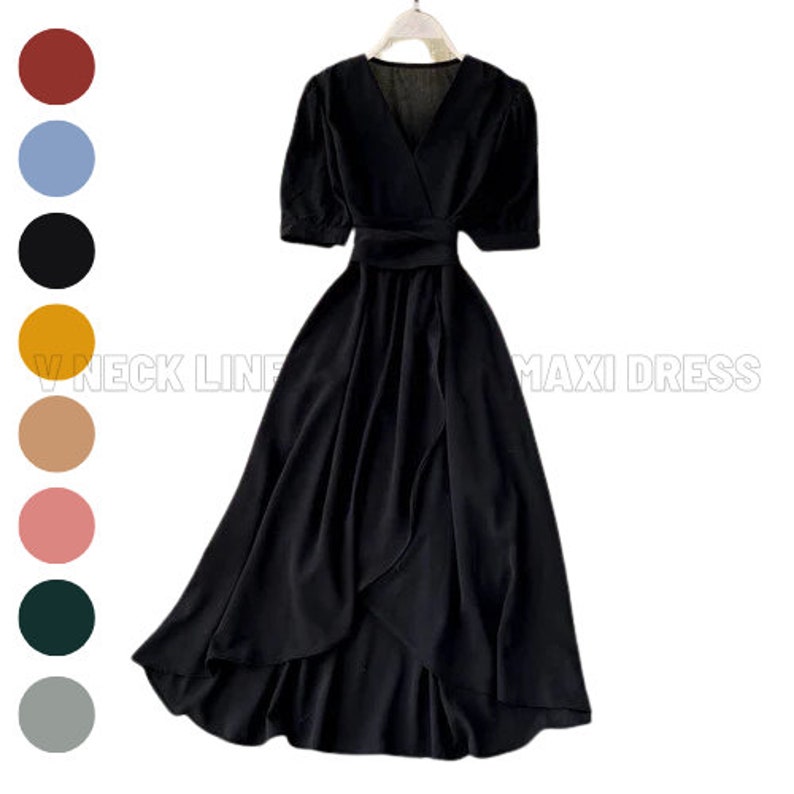 a women's black dress with a v - neckline and short sleeves