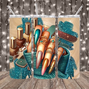 May include: A set of three stainless steel tumblers with a design featuring a hand with colorful nail polish and gold rings, surrounded by nail polish bottles and glitter. The tumblers have a wood grain finish.