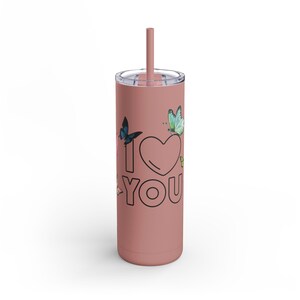 May include: A pink stainless steel tumbler with a straw and a design of butterflies and the text "I love you".