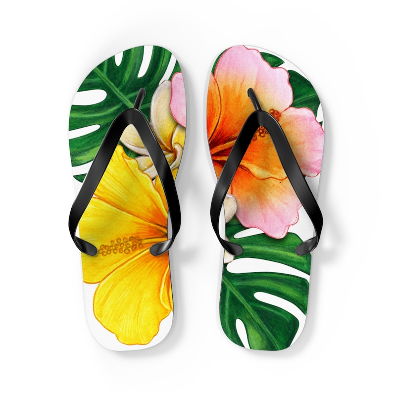 Green, yellow and pink flip flops with a tropical vibe.Acheerful summer essential.adding fun to your summer wardrobe.