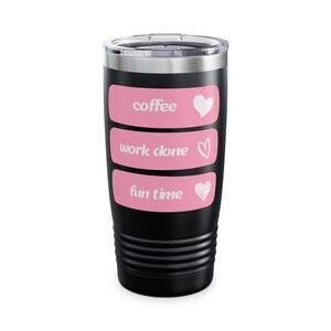 May include: Black insulated tumbler with a silver lid. The tumbler has three pink rectangular labels with white text that reads "coffee", "work done", and "fun time". Each label has a white heart symbol.