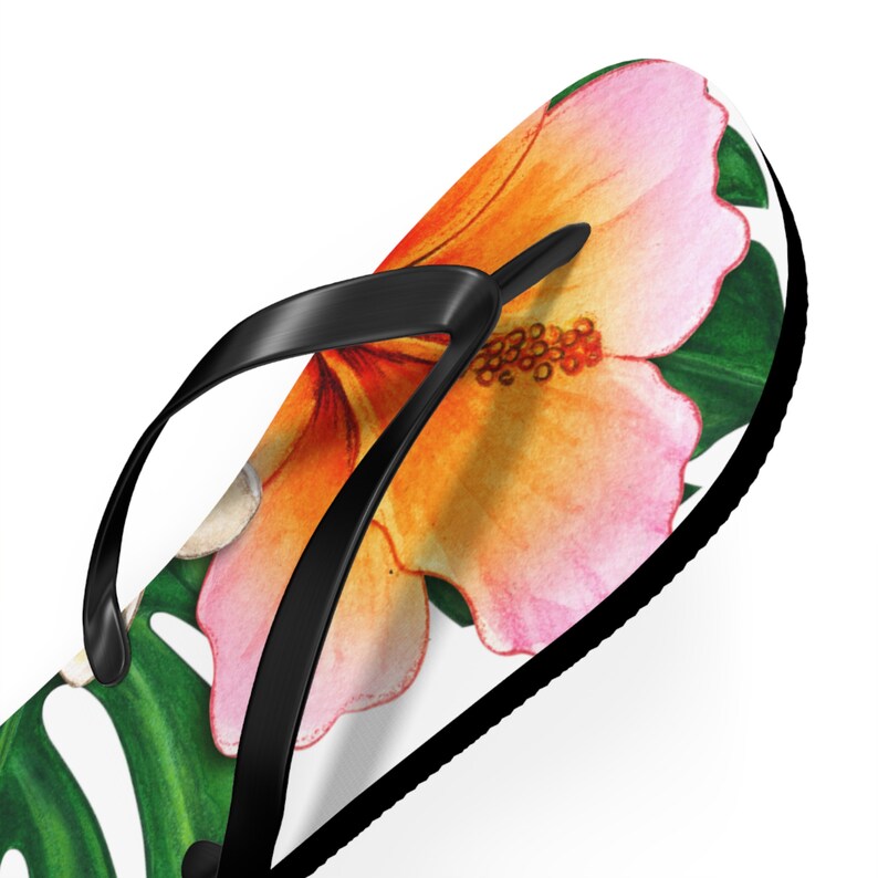 Green, yellow and pink flip flops with a tropical vibe.Acheerful summer essential.adding fun to your summer wardrobe.