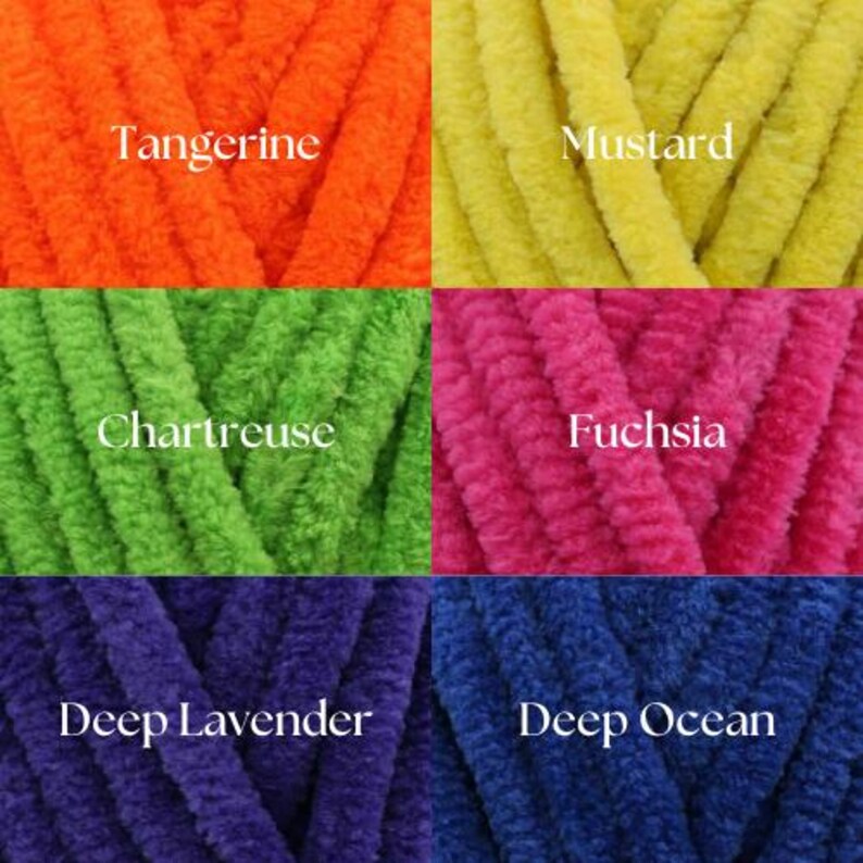 May include: Five spools of yarn in different colors: tangerine, mustard, chartreuse, fuchsia, and deep lavender. The yarn is a soft, fuzzy texture.