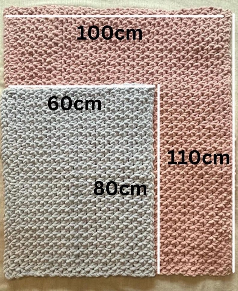 May include: Two knitted blankets, one light gray and one pink, with measurements in centimeters. The gray blanket is 80cm by 60cm and the pink blanket is 110cm by 100cm.