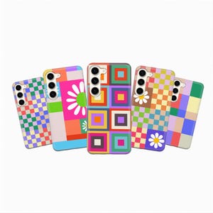 May include: Five colorful phone cases with vibrant geometric and floral designs. The cases feature squares, checkerboard patterns, and daisy graphics in a variety of colors, including pink, orange, green, and purple.