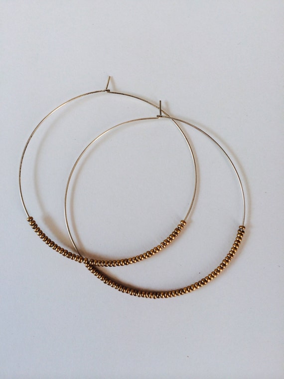 Large delicate beaded hoops. 2"