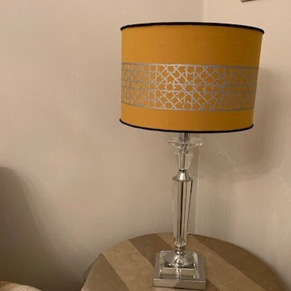 A unique hand painted lampshade depicting the geometric patterns found in Islamic art and architecture.