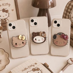 ハローキティのアクリル製スマホグリップ、かわいい粘着式スマホスタンド、彼女への誕生日プレゼント、ブラウンのキティチャーム