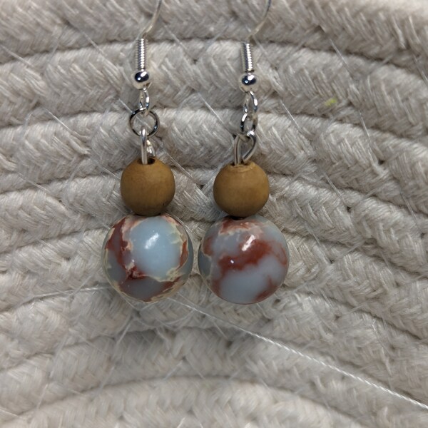 Artisan Handmade stone earrings. Sterling silver earring hooks. These are light blue Jasper with burnt orange and ivory accents.