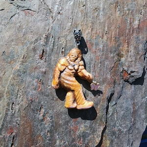 Sasquach Bigfoot Pendant Chasing a pink butterfly sculpted Clay and Hand painted