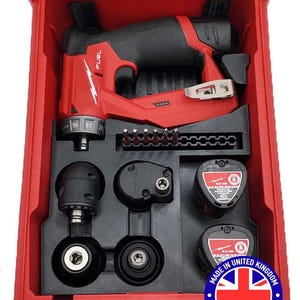 May include: A red and black power tool kit, featuring a drill and several attachments, all stored in a red case. The kit includes a "FUEL" branded drill and two batteries. The case is marked "MADE IN UNITED KINGDOM".