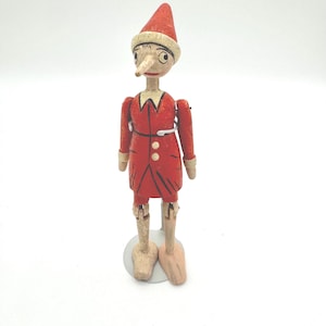 Wooden Pinocchio Puppet Figurine with Stand – Hand-Painted Jointed Folk Art Doll