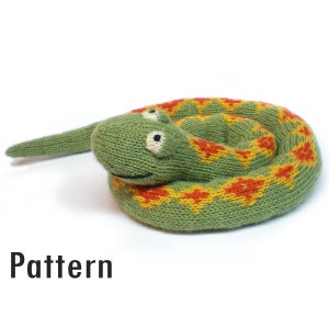 May include: A green knitted snake toy with orange and yellow stripes. The snake is curled up in a circle with its head facing the viewer. The snake has two black eyes and a small smile.