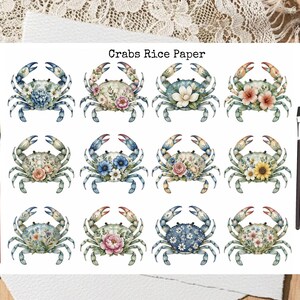 May include: A sheet of Crabs Rice Paper featuring twelve distinct illustrations of crabs decorated with various floral arrangements. The sheet includes two paintbrushes, one with a red handle and one with a black handle, placed on the sides.