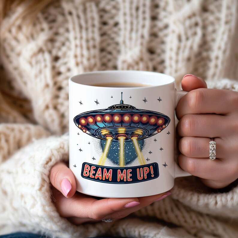 May include: White ceramic mug with a blue and red illustration of a flying saucer with the text "Beam Me Up!" printed on the front.