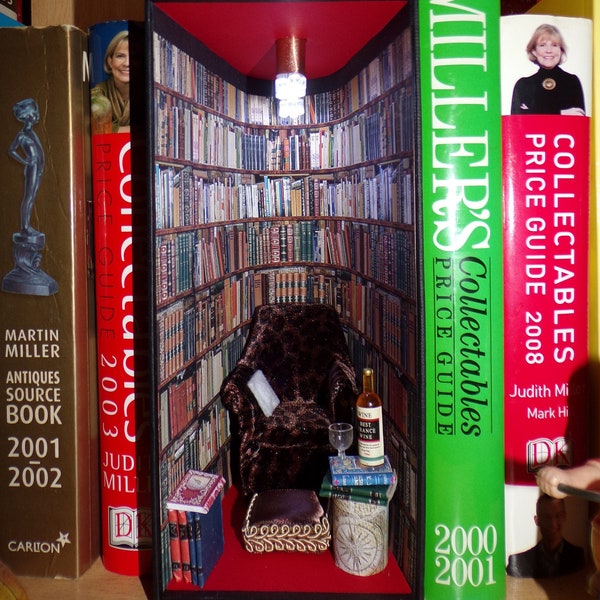 Booknook, book nook, diorama. Cosy chair in old fashioned vintage  library. Optional cat.