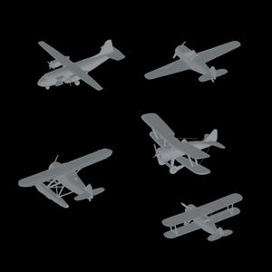 May include: A collection of five gray model airplanes, including a biplane, a propeller plane, and a jet plane. The airplanes are all in different positions, some are flying and some are landing.