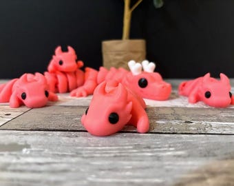 Familia de dragones articulados impresos en 3D