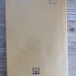 May include: The back cover of a tan-colored book with the text "Published by Charles Scribner's Sons &bull; New York" and the ISBN number "684-13335-0".