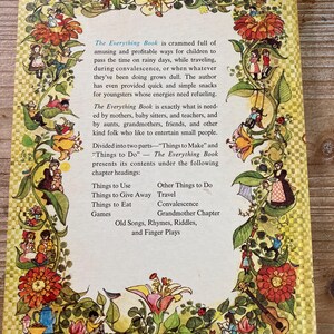 May include: The back cover of "The Everything Book" features a floral border with illustrations of children and whimsical scenes. Text describes the book's contents, including activities and recipes for children. The book is designed to entertain children during various situations.