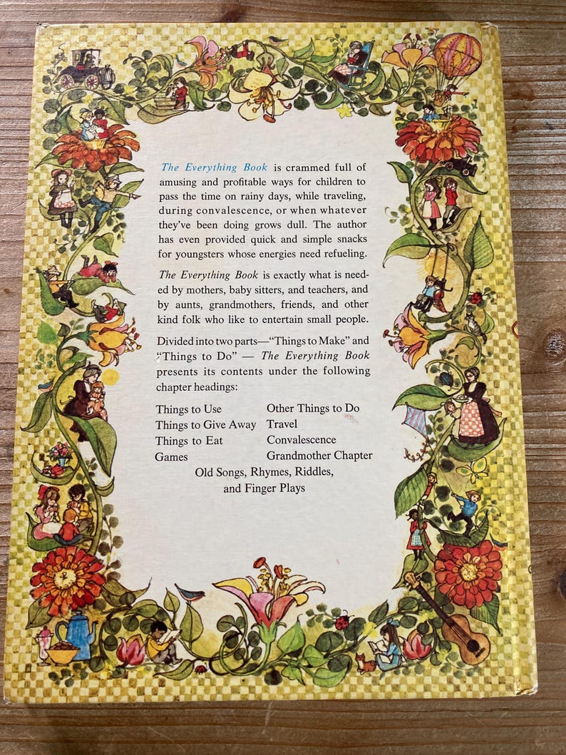 May include: The back cover of "The Everything Book" features a floral border with illustrations of children and whimsical scenes. Text describes the book's contents, including activities and recipes for children. The book is designed to entertain children during various situations.