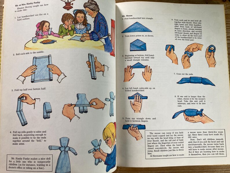 May include: Vintage illustrated instructions from a children's book, showing how to fold a handkerchief into a doll and a mouse. The illustrations are in color and feature people and hands demonstrating the folding steps.