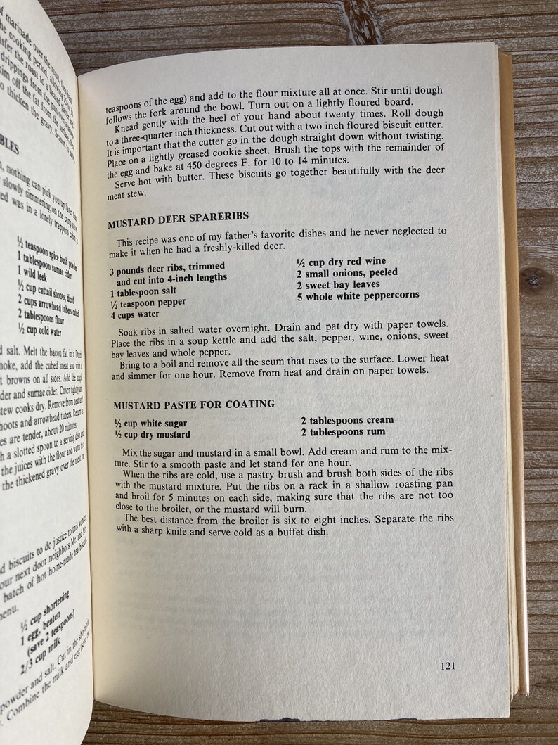 May include: A vintage cookbook page with a recipe for Mustard Deer Spareribs. The recipe includes ingredients like deer ribs, dry red wine, onions, and white peppercorns. The recipe also includes instructions for making a mustard paste for coating the ribs.