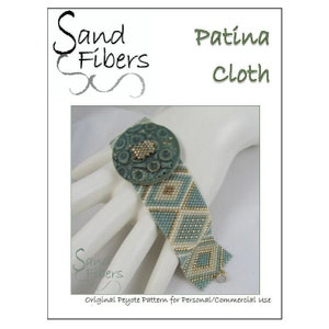 May include: A beaded bracelet with a green and white geometric pattern. The bracelet has a large, round, green button with a textured surface. The bracelet is on a white hand. The text "Sand Fibers Patina Cloth" is at the top of the image. The text "Original Peyote Pattern for Personal/Commercial Use" is at the bottom of the image.