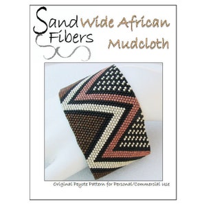 May include: A beaded bracelet with a geometric pattern in brown, black, white, and pink. The bracelet is made with peyote stitch and is labeled "Sand Wide African Fibers Mudcloth".