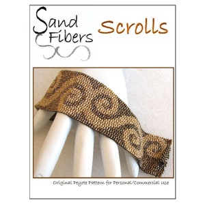 May include: A brown and gold beaded bracelet with a swirling pattern. The bracelet is made with peyote stitch and is called "Sand Scrolls".