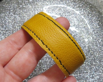 Gold Genuine Buckskin Cuff Bracelet which has been hand-stitched
