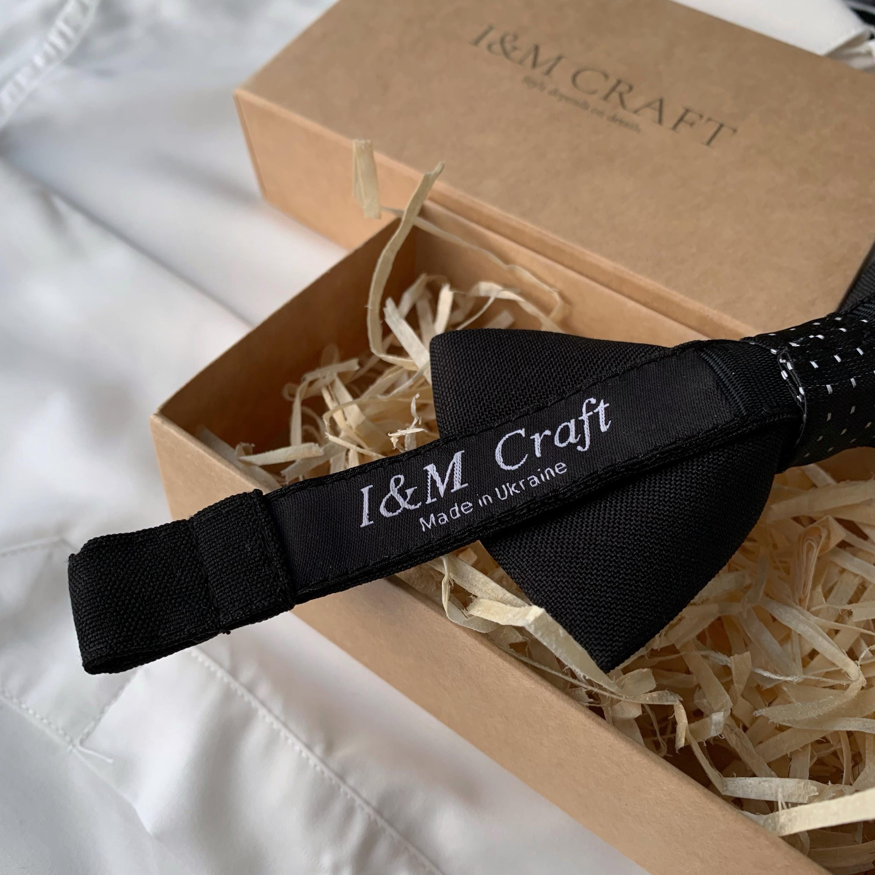 mens black bow tie and suspenders