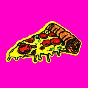 May include: A yellow embroidered patch of a pizza slice with red pepperoni, green peppers, and brown crust.
