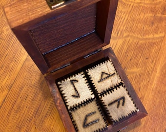 Rune dice set in wooden box.