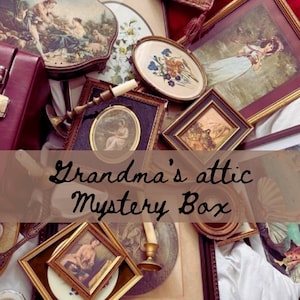 May include: A collection of vintage framed pictures and a small wooden box with a red velvet lining. The pictures are all in ornate frames and feature various subjects, including landscapes, portraits, and still lifes. The text "Grandma's attic Mystery Box" is superimposed on the image.