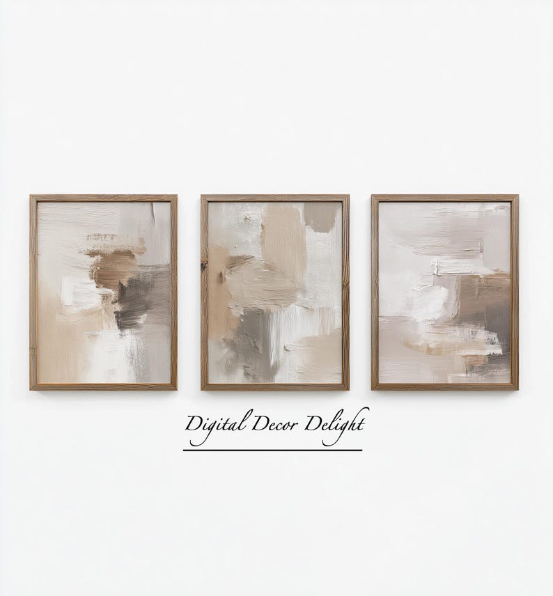 May include: Three framed abstract art prints. Each print features a neutral color palette of beige, brown, and white brushstrokes. The frames are made of light brown wood. The text "Digital Decor Delight" is below the prints.