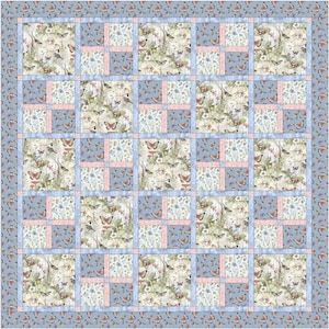 May include: A patchwork quilt featuring a repeating grid of squares with butterfly and floral patterns in shades of blue, pink, and cream. The design includes a wide border decorated with small butterflies on a light blue background.
