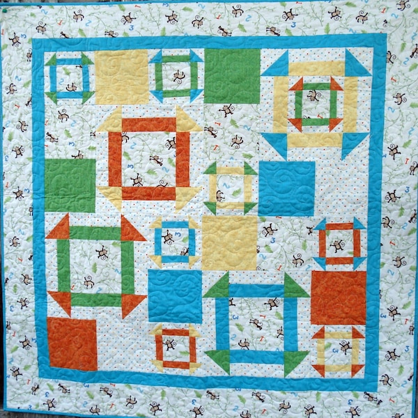 Modern Monkey Wrench Quilt PDF Pattern, uses four colors plus feature fabric - two block sizes makes this a fun quilt to make and give