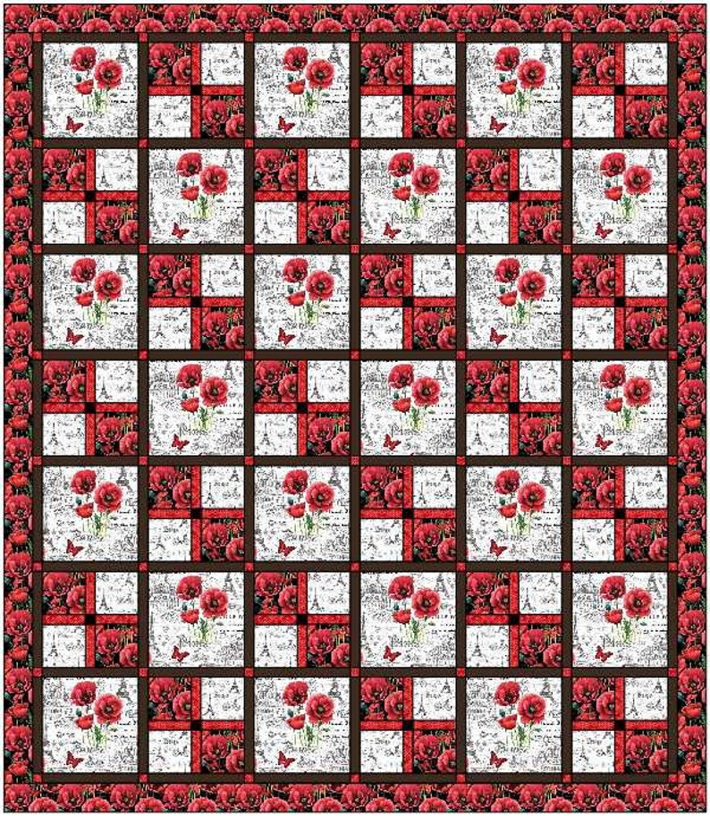 May include: A red, white, and black quilt with a repeating pattern of red poppies and a white background with a black and white pattern. The quilt is framed with a black border.