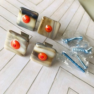 May include: A handmade, wooden serving tray with a natural finish. The tray features a rectangular shape with raised edges and integrated handles. The wood grain is visible, showcasing the tray's craftsmanship. Dimensions are approximately 16 inches long, 10 inches wide, and 2 inches high.