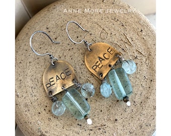 PEACE. Blue Quartz and Aquamarine gemstones accent a stamped brass token. Handmade by Anne More Jewelry