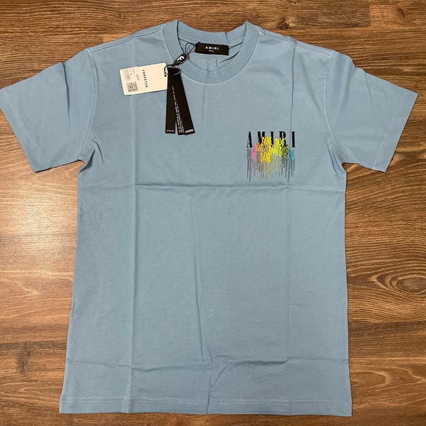 Amiri Aesthetic Sky Blue Tee with Vibrant Drip Paint Graphic