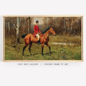 May include: A framed vintage print depicts a man in a red coat and top hat riding a brown horse through a forest. The artwork has a gold frame and the text "COZY NEST GALLERY | VINTAGE FRAME TV ART" is at the bottom.